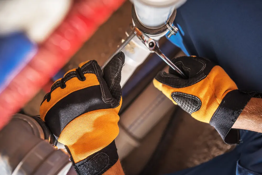 Commercial plumber completing a dependable building repair